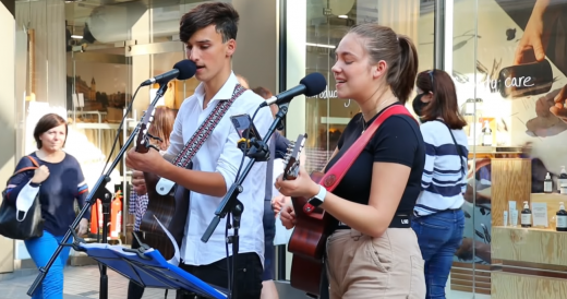 Teen Buskers Capture Attention With Their Duet Of “Unchained Melody”