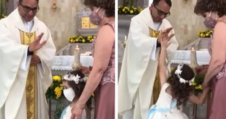 Little Girl “High Fives” Priest During Blessing